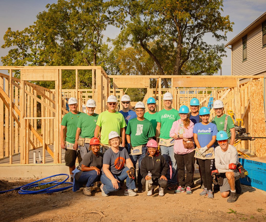 Volunteer group in front of home build