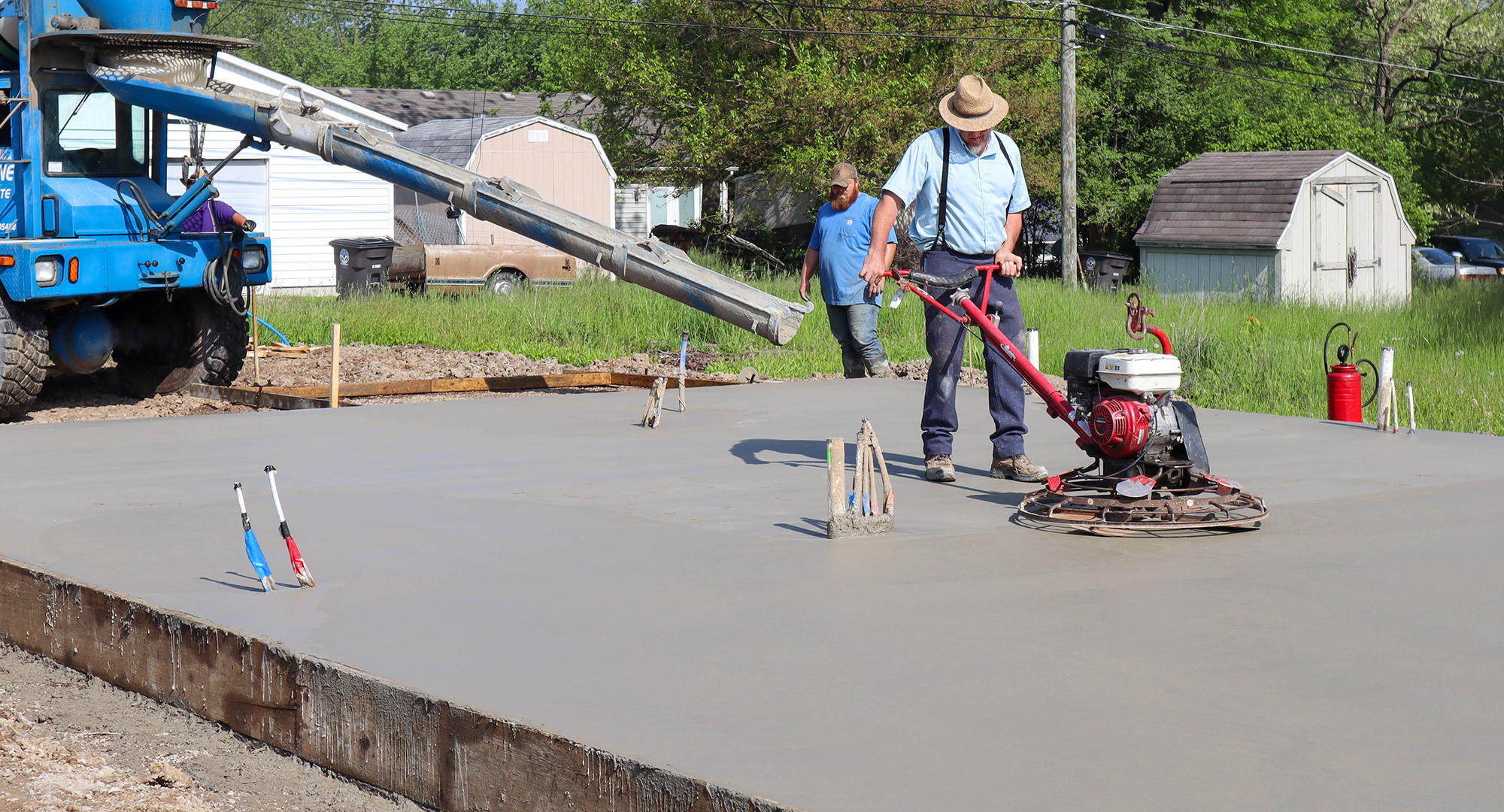 Pouring and smoothing concrete slab
