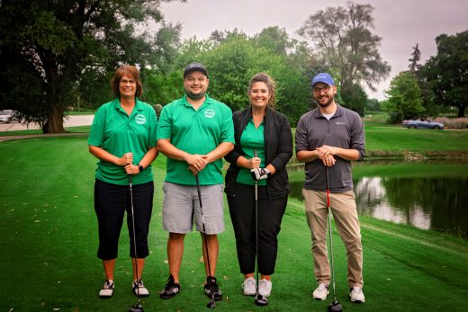 ProFed group with two women and two men at golf outing
