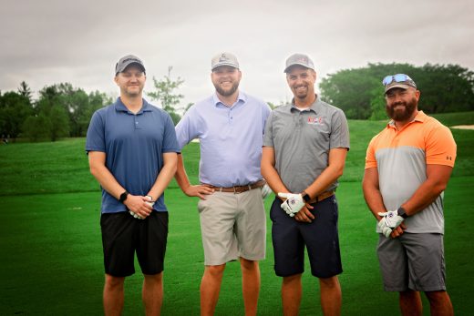 group of 4 males golfing