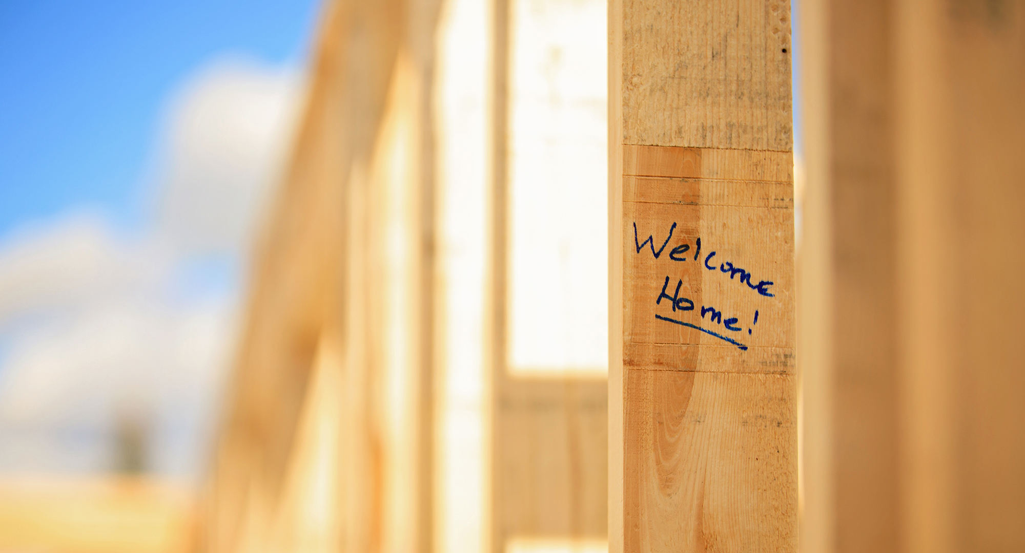 "Welcome Home" written on wood board