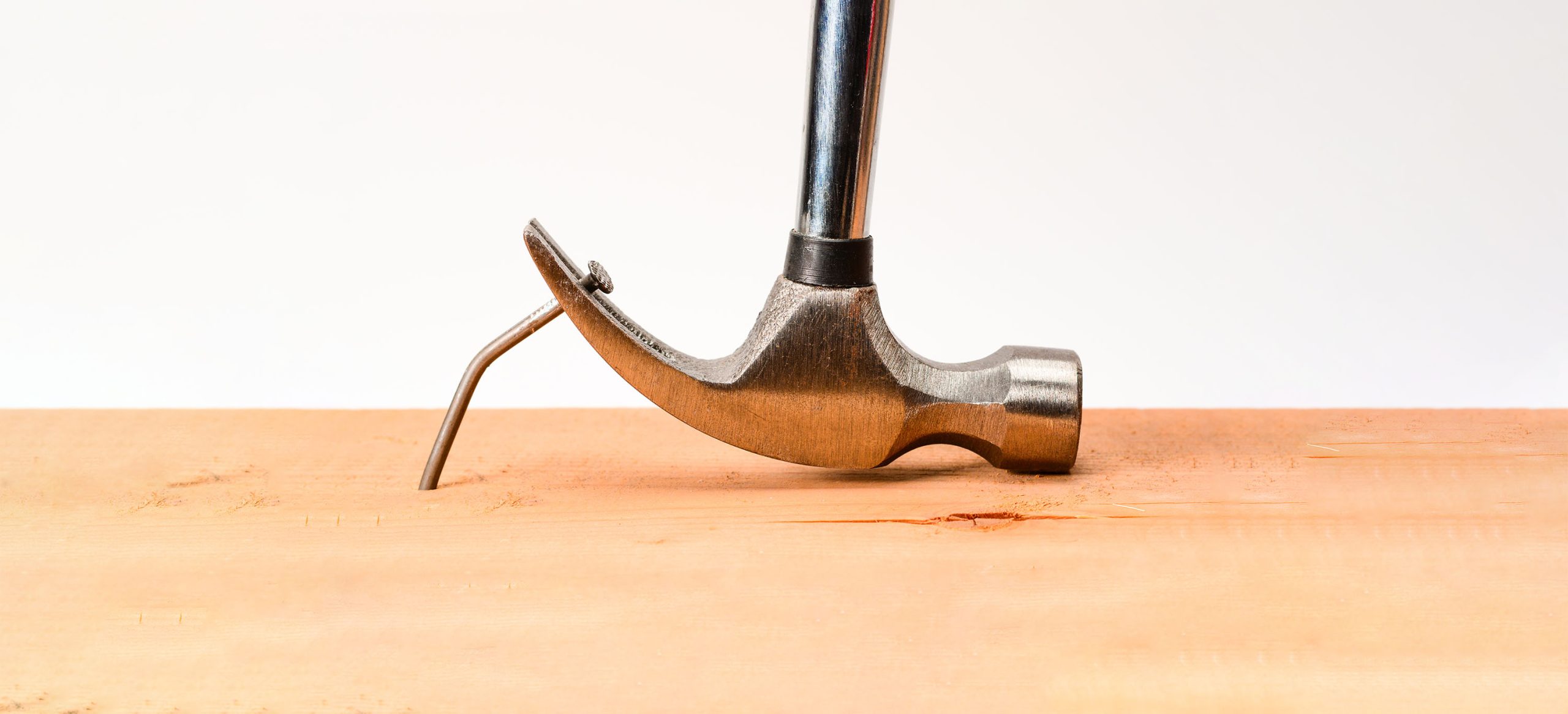 Hammer pulling bent nail