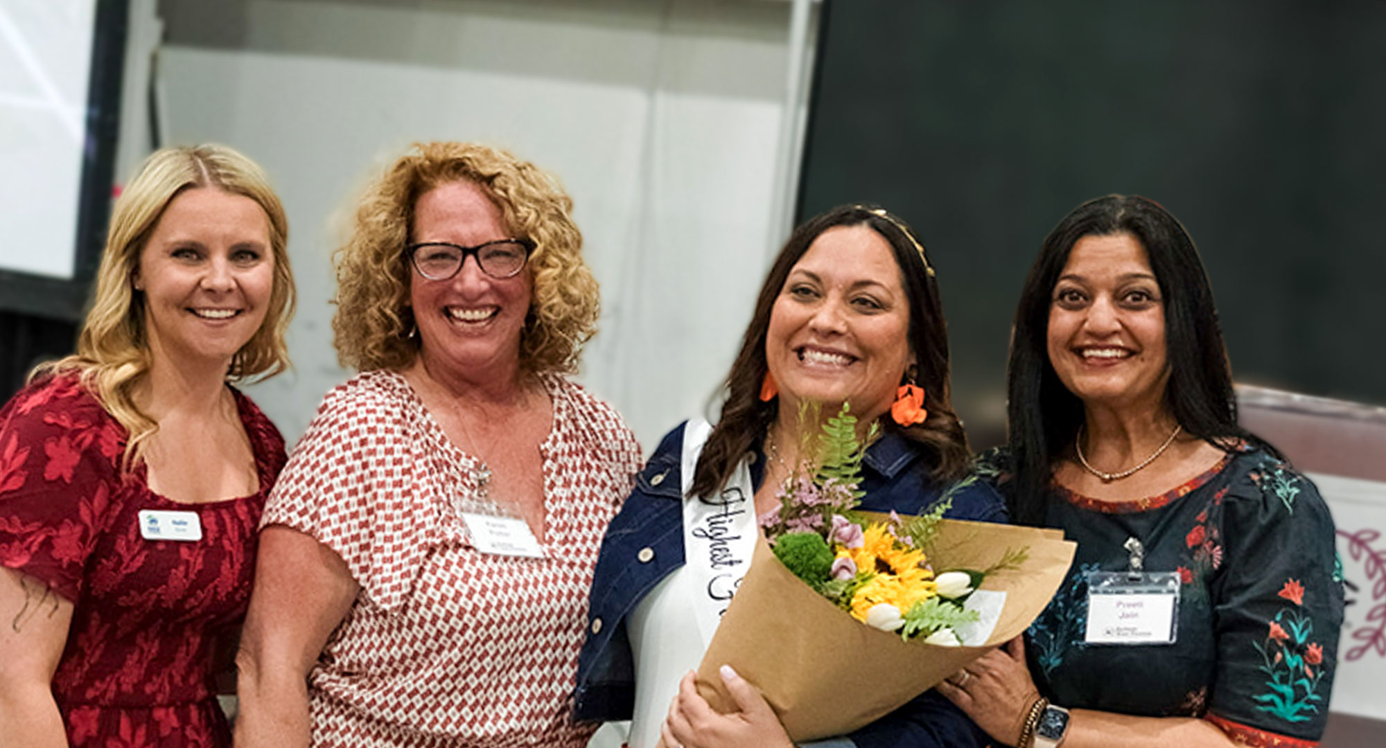 Four women smiling for camera at ReStore Your Passion