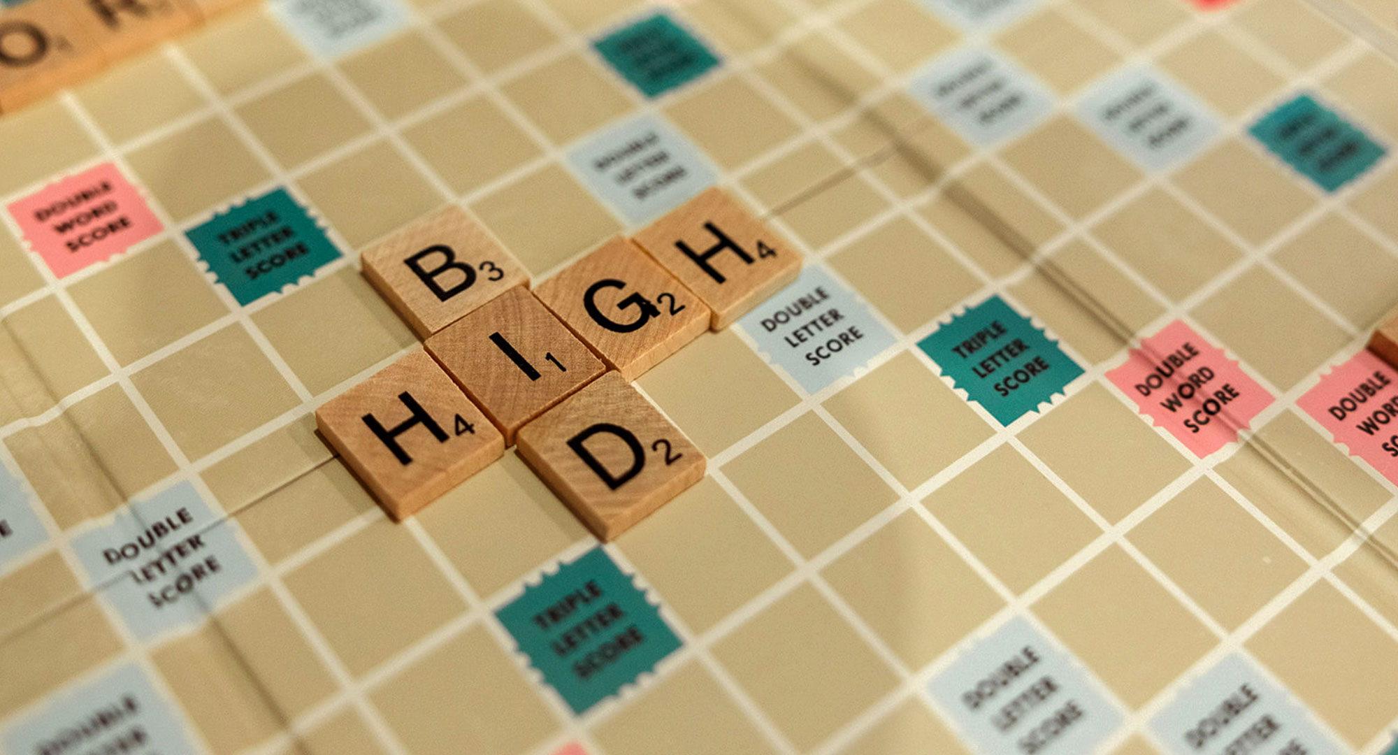 Scrabble letters "Bid High"
