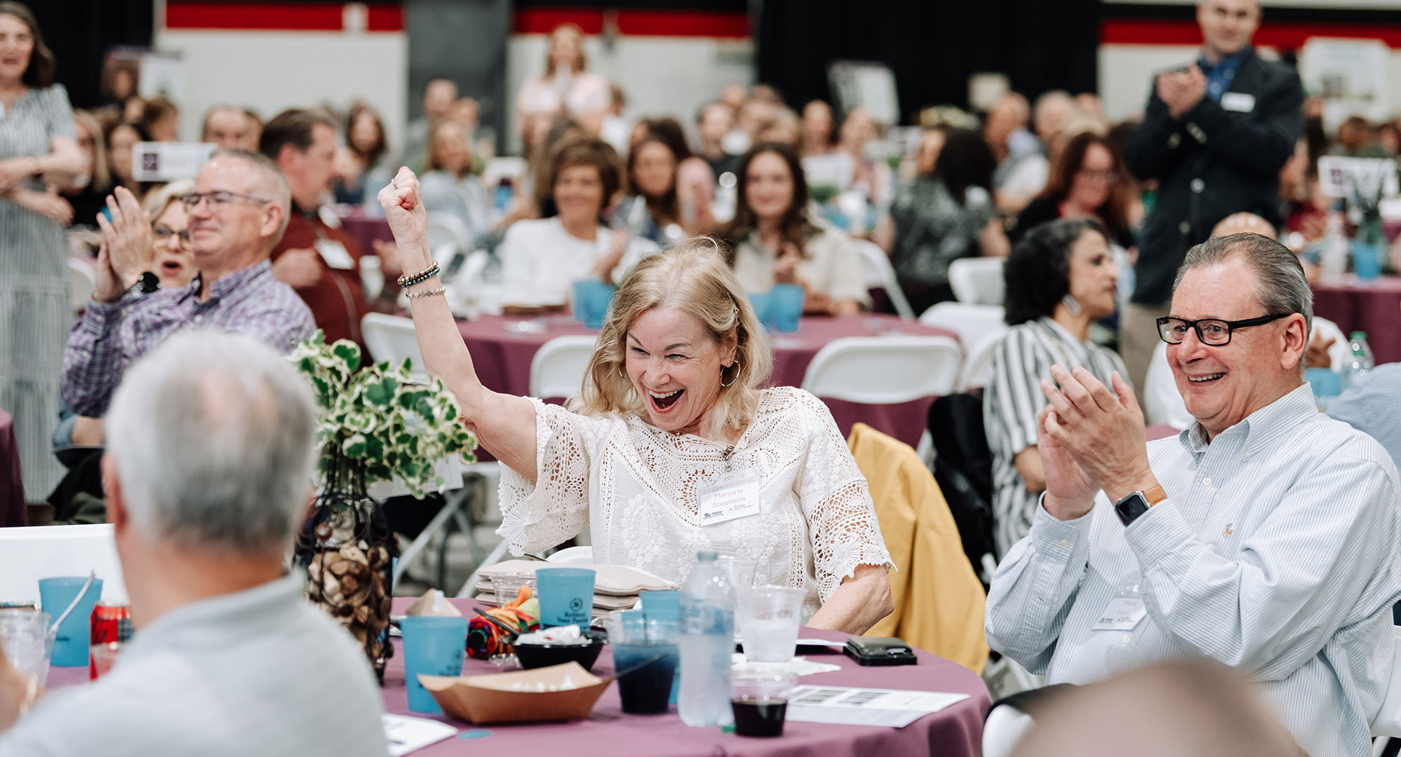 Woman Cheering at ReStore Your Passion